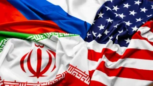 Top-down view of the Iranian, United States, and Russian flags on rippled fabric.
